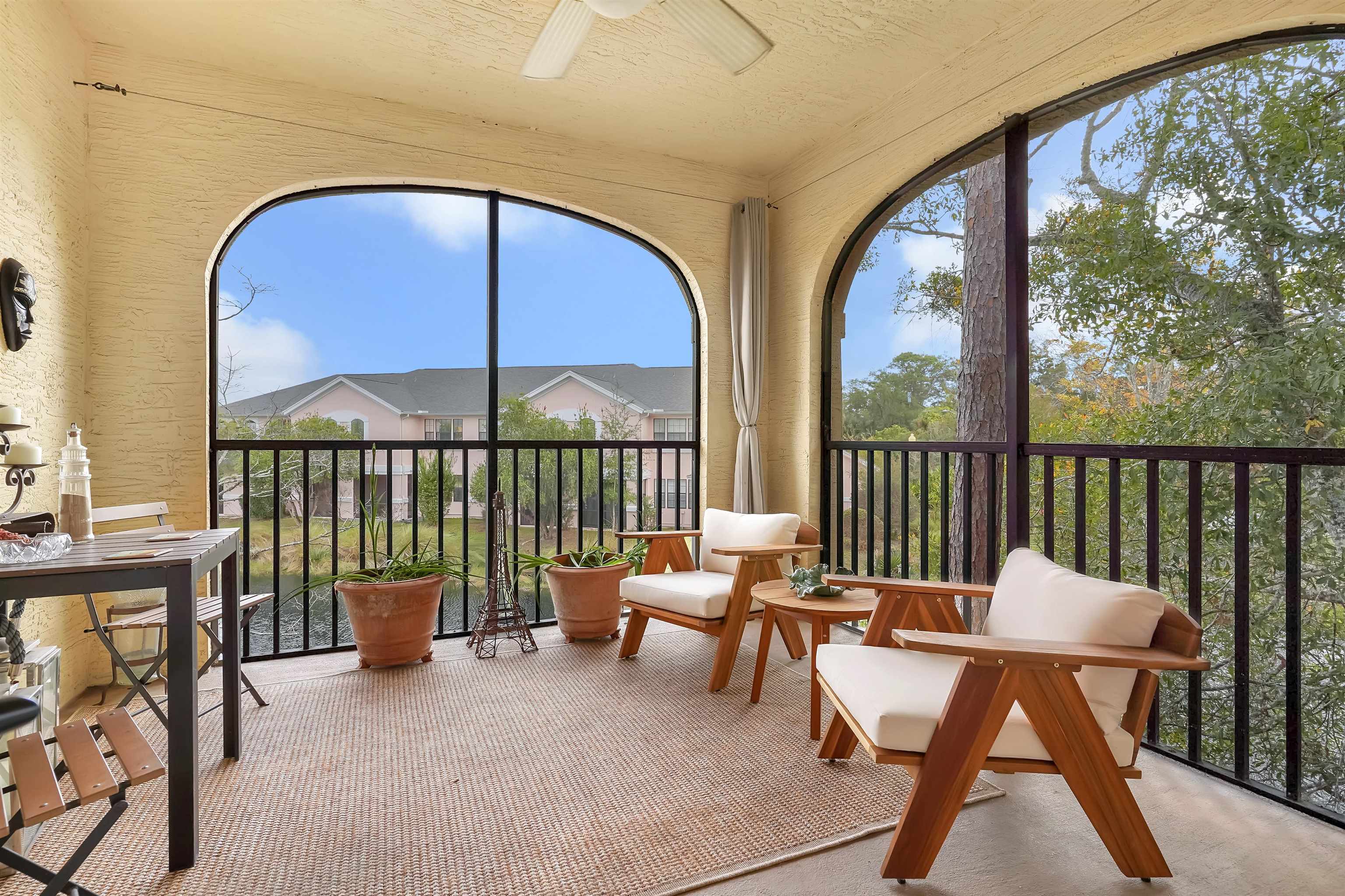 4629 Serena Circle St. Augustine, FL 32084 - Photo 30 of 47 a balcony with a table and chairs