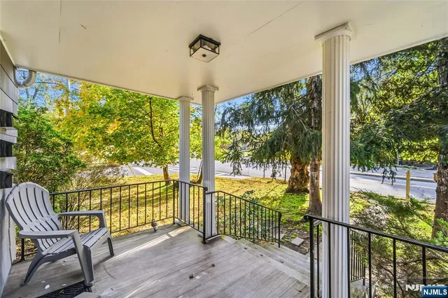 a view of a room with wooden floor and outdoor space