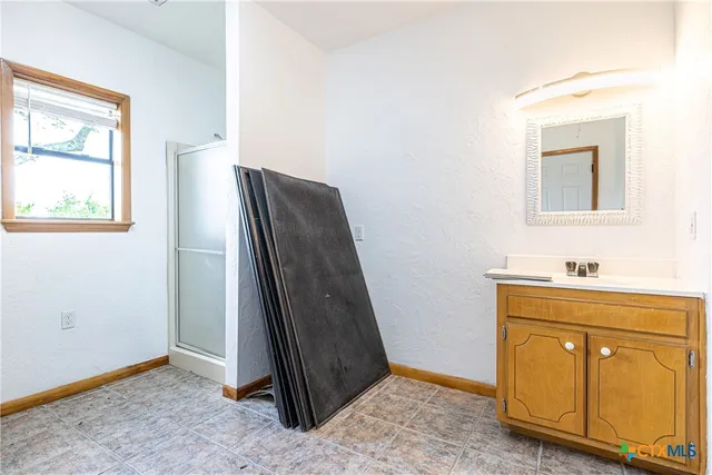 a view of bathroom with dual sinks