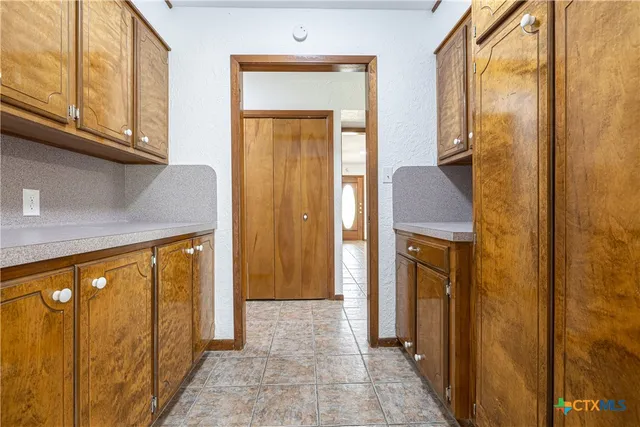 a view of hallway with washer and dryer