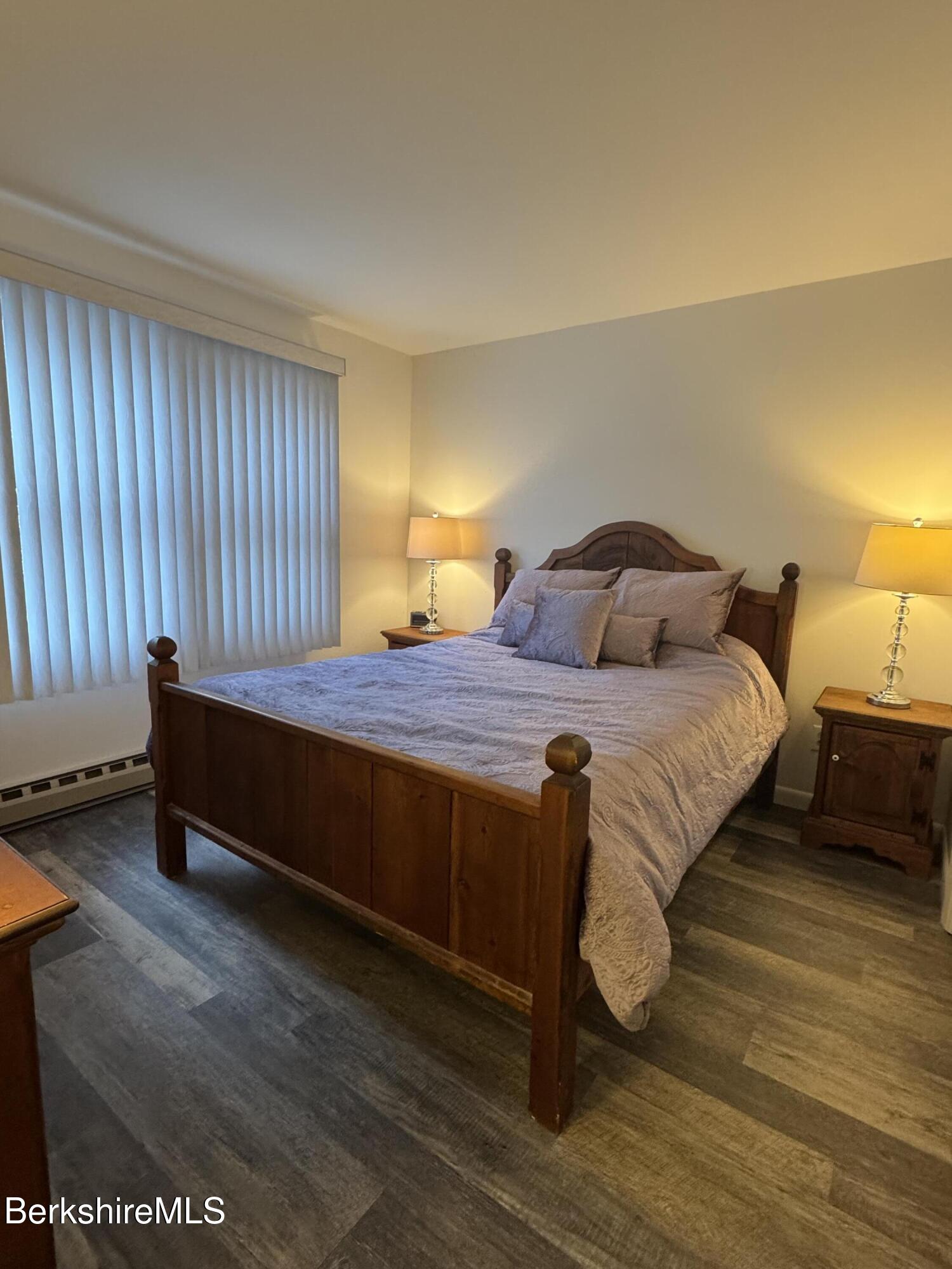 37 Corey Road, Unit 14 Hancock, MA 01237 - Photo 8 of 36 a bedroom with a bed and wooden floor
