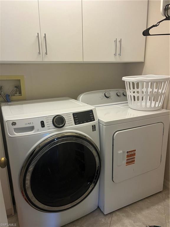 513 Lake Louise Circle, Unit 202 Naples, FL 34110 - Photo 13 of 15 a utility room with dryer and washer