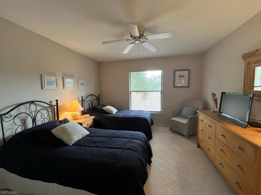 513 Lake Louise Circle, Unit 202 Naples, FL 34110 - Photo 6 of 29 a bedroom with a bed and window