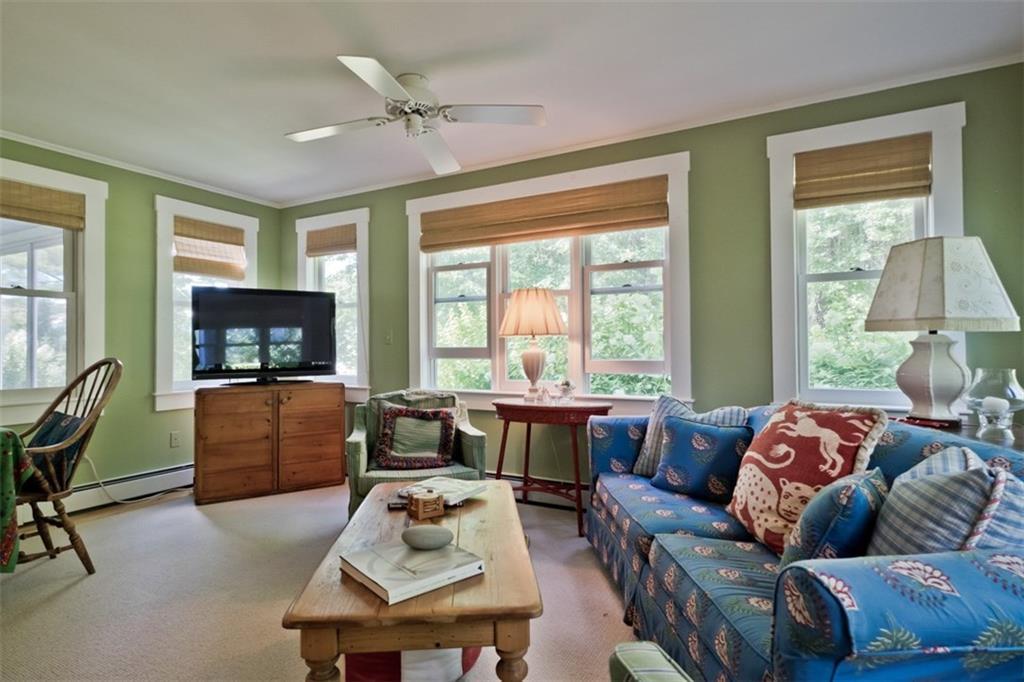 1097 Main Street Lovell, ME 04051 - Photo 15 of 34 This living area has a wood stove,...