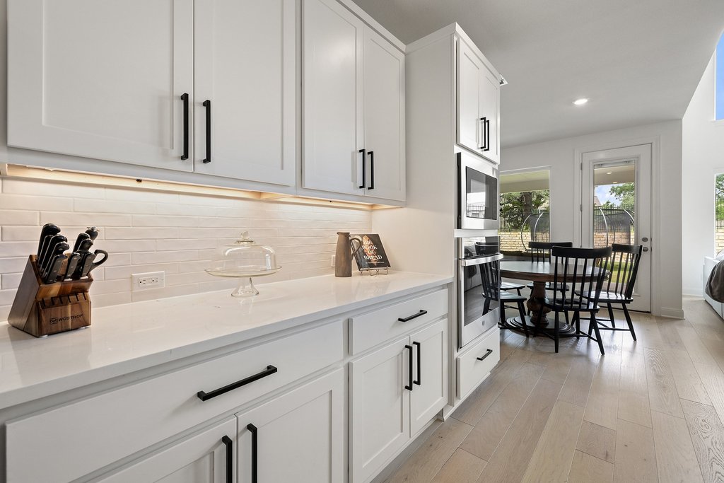 365 Pear Tree Lane Austin, TX 78737 - Photo 17 of 39 a kitchen with stainless steel appliances microwave and cabinets