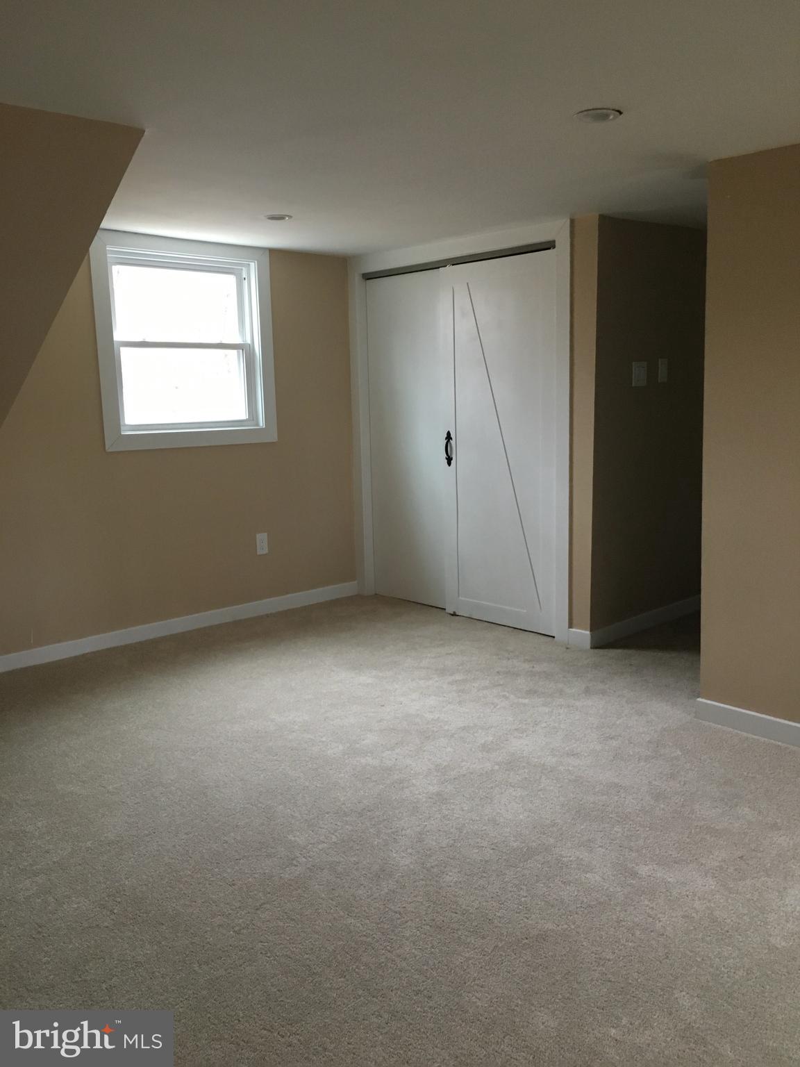 95 Duffield Street Willow Grove, PA 19090 - Photo 13 of 20 an empty room with windows and closet