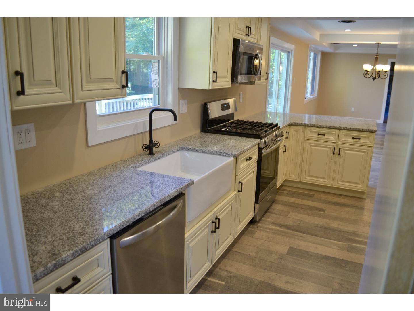 95 Duffield Street Willow Grove, PA 19090 - Photo 8 of 20 a kitchen with a sink stove and cabinets