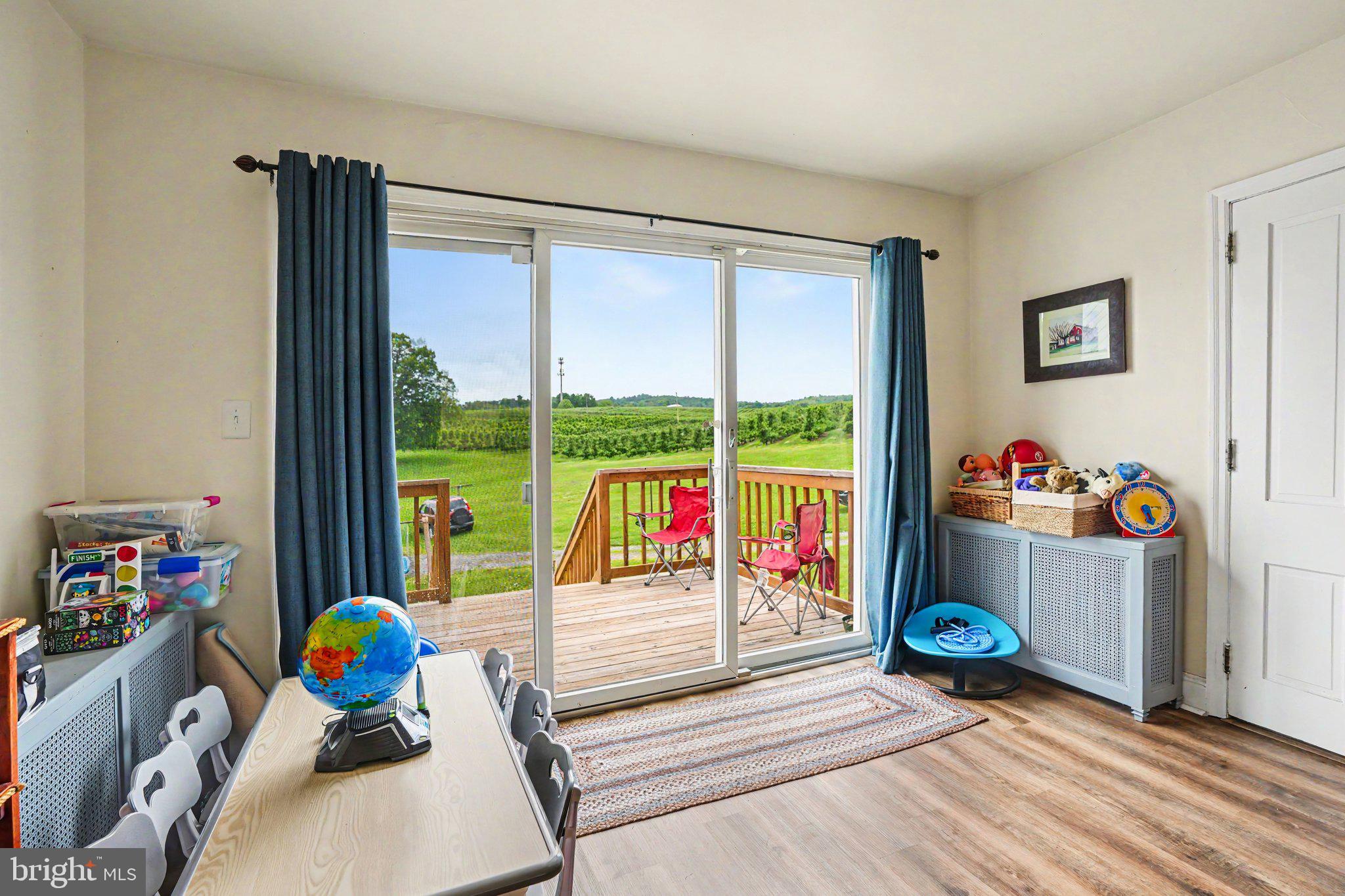 420 Carlisle Road Biglerville, PA 17307 - Photo 15 of 41 a view of play room with wooden floor and windows