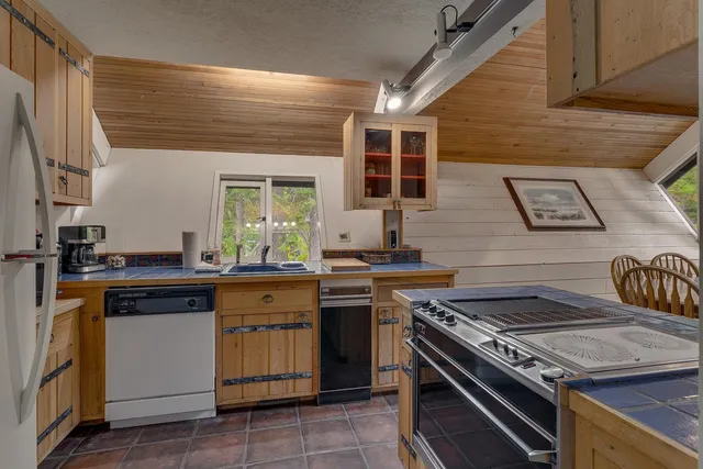 a kitchen with a stove and a sink