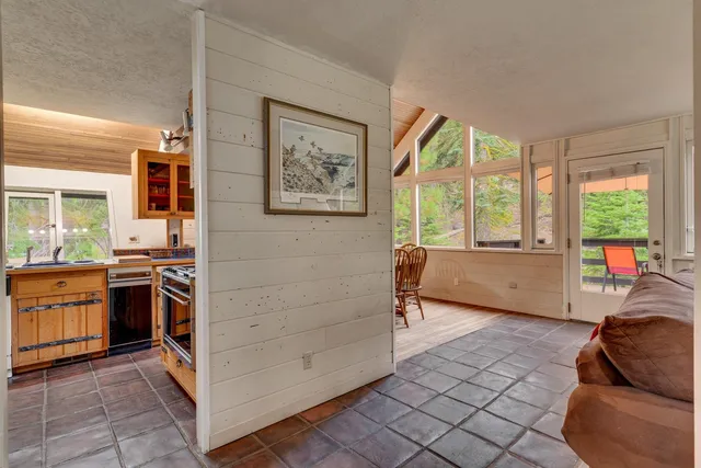 a view of a kitchen with a stove cabinets and a window