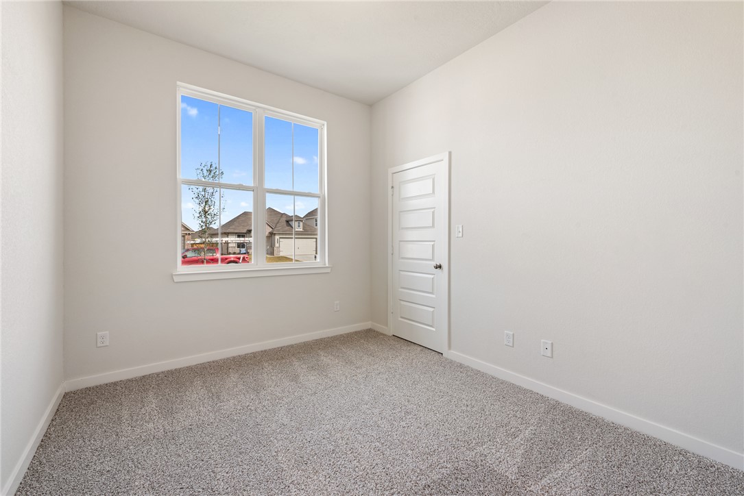 2415 Rooke Road Bryan, TX 77807 - Photo 7 of 36 an empty room with windows