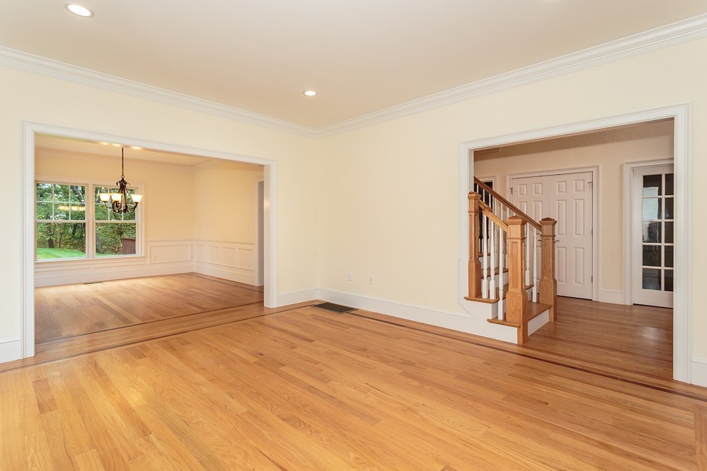 18 Shade Street Lexington, MA 02421 - Photo 4 of 23 a view of an empty room with wooden floor and a window