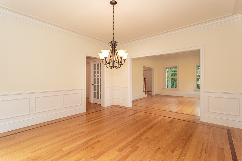 18 Shade Street Lexington, MA 02421 - Photo 7 of 23 a view of a room with wooden floor and white walls