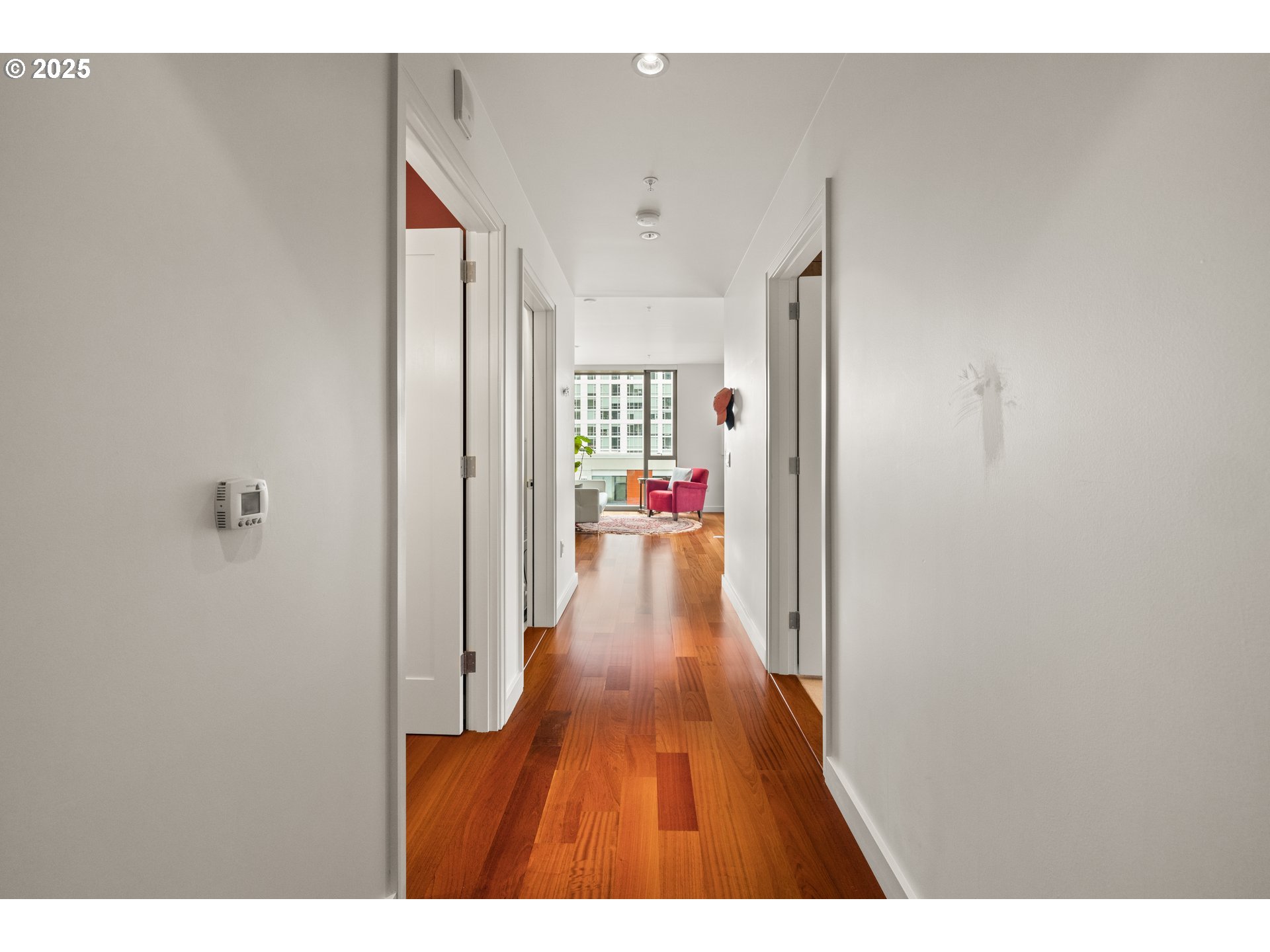 841 Southwest Gaines Street, Unit 714 Portland, OR 97239 - Photo 14 of 48 a view of a hallway with wooden floor