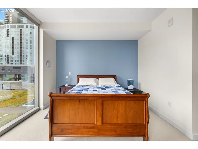 a room with a bed and a dresser