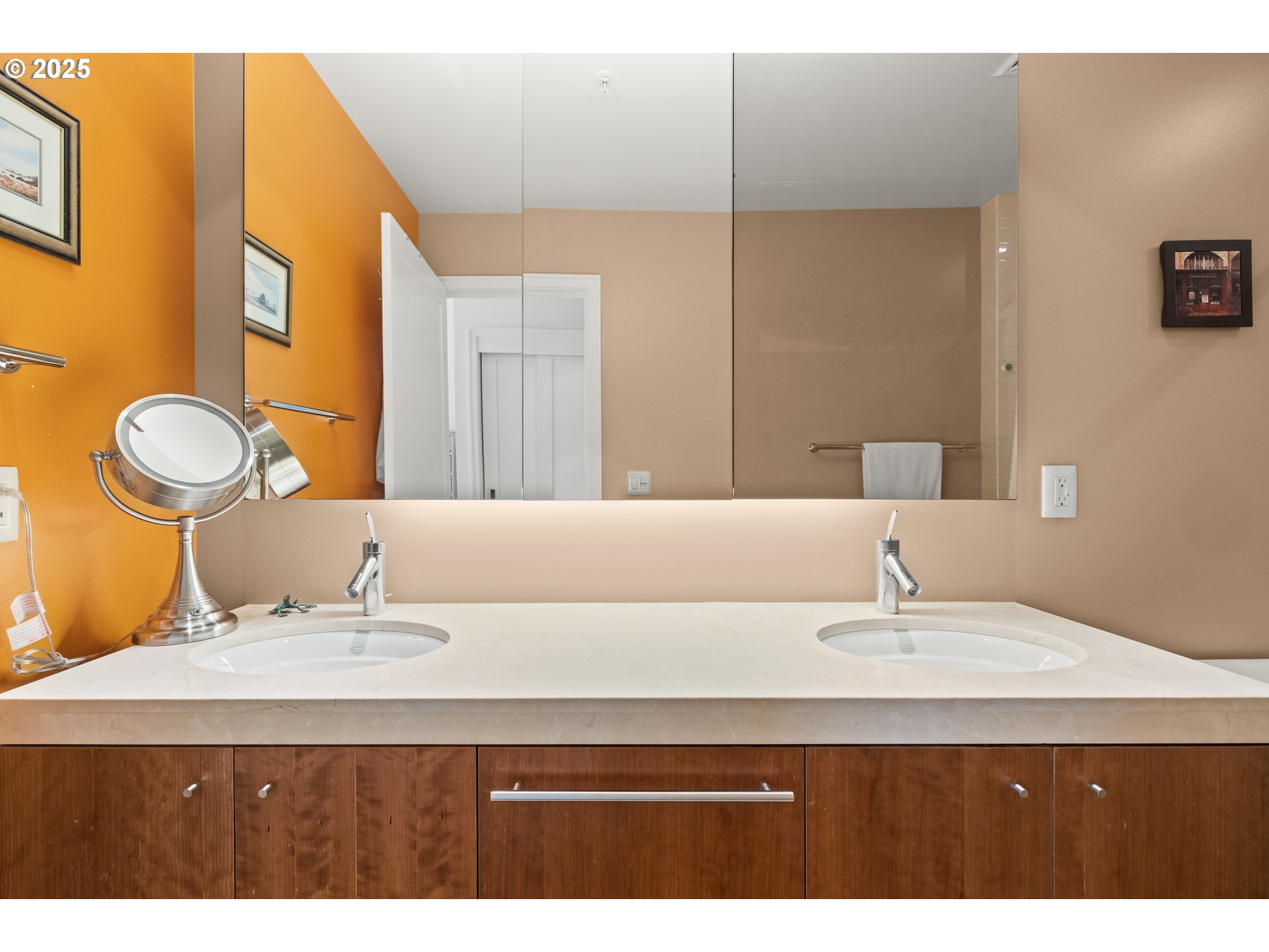 841 Southwest Gaines Street, Unit 714 Portland, OR 97239 - Photo 22 of 48 a bathroom with a sink and a mirror