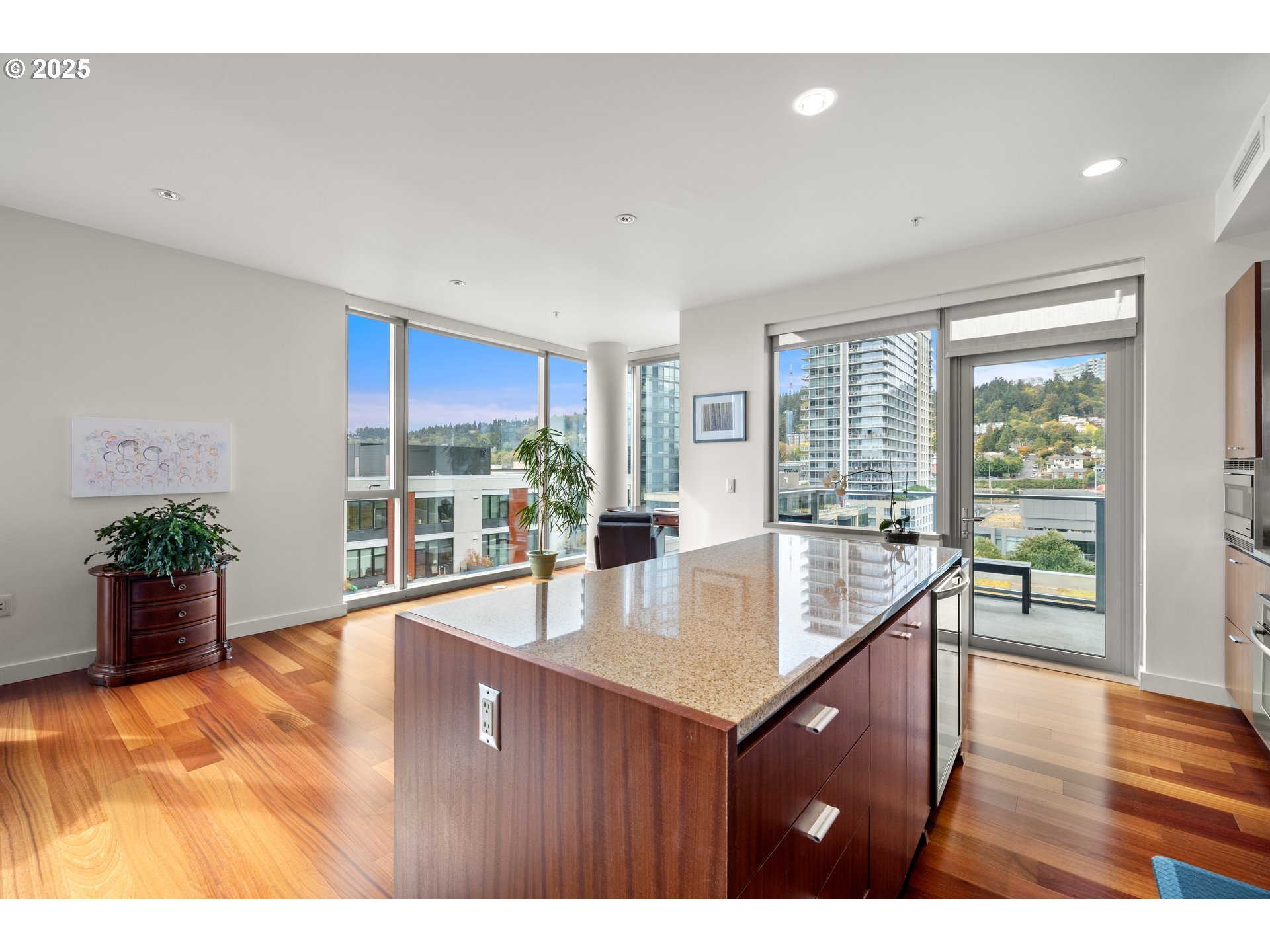 841 Southwest Gaines Street, Unit 714 Portland, OR 97239 - Photo 31 of 48 a living room with furniture and a large window