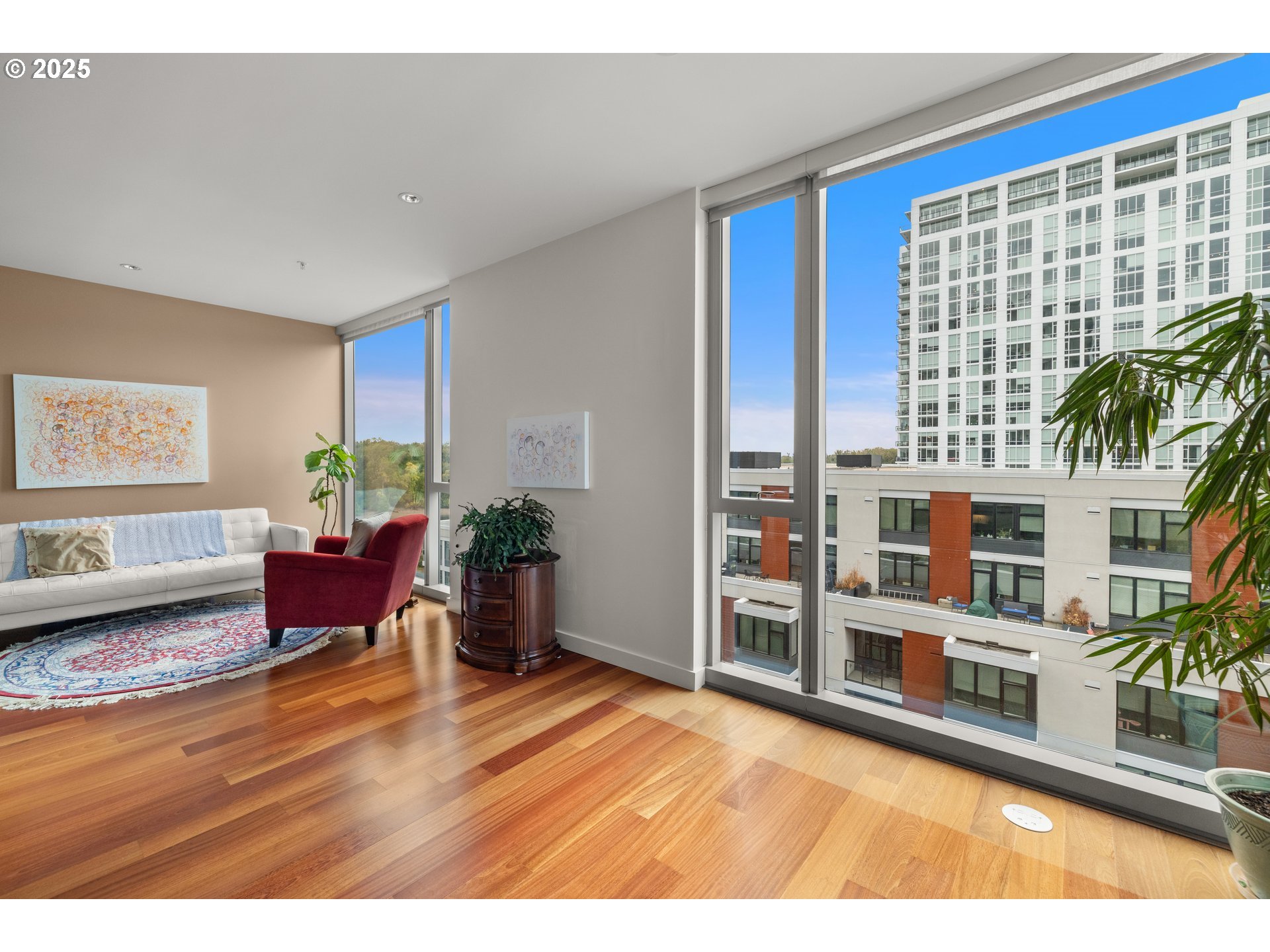 841 Southwest Gaines Street, Unit 714 Portland, OR 97239 - Photo 34 of 48 a living room with furniture and a wooden floor