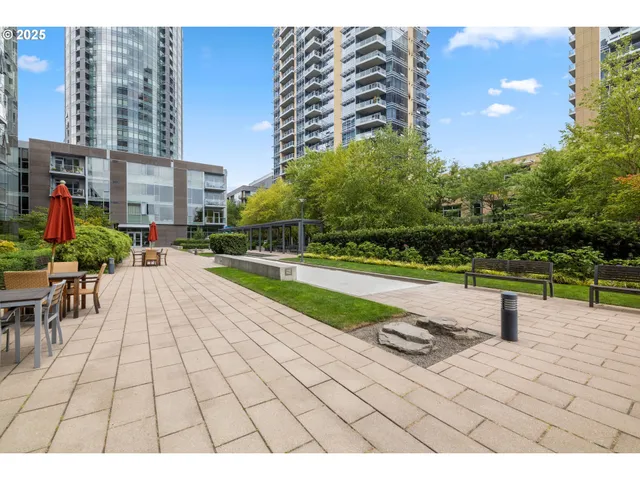 a view of swimming pool outdoor seating and trees