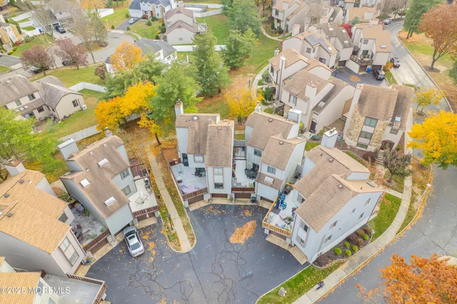 an aerial view of residential house with outdoor space and parking
