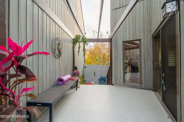 a backyard of a house with furniture and outdoor seating