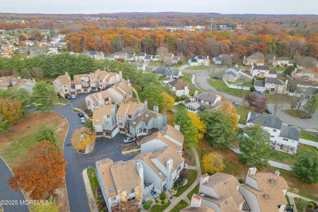 an aerial view of residential houses with outdoor space