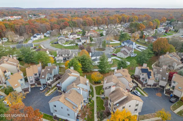 an aerial view of residential houses with outdoor space