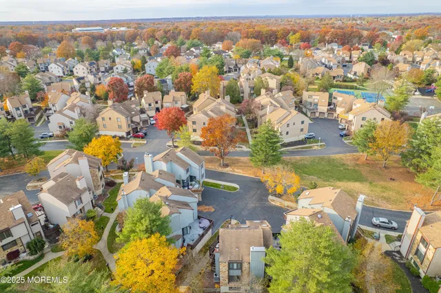 an aerial view of residential building and parking space