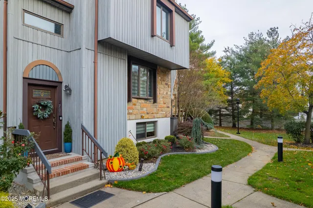 a front view of a house with garden
