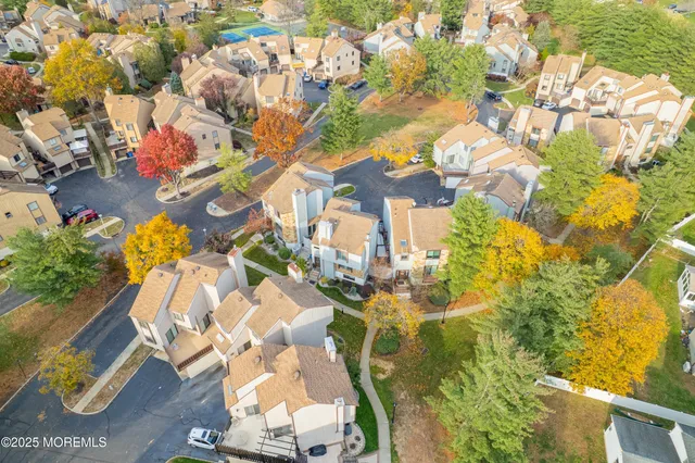 an aerial view of residential houses with outdoor space