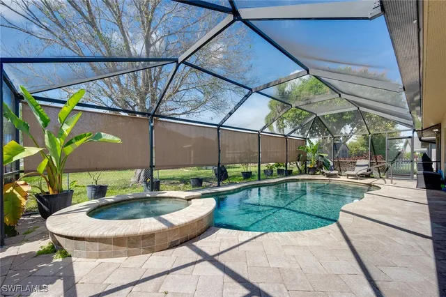 a view of a backyard with swimming pool