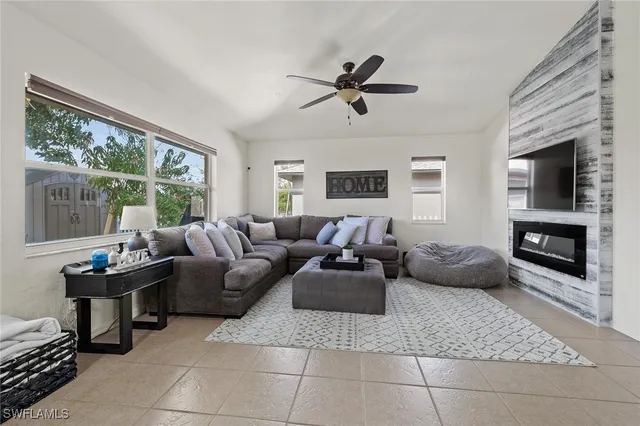a living room with furniture and a fireplace