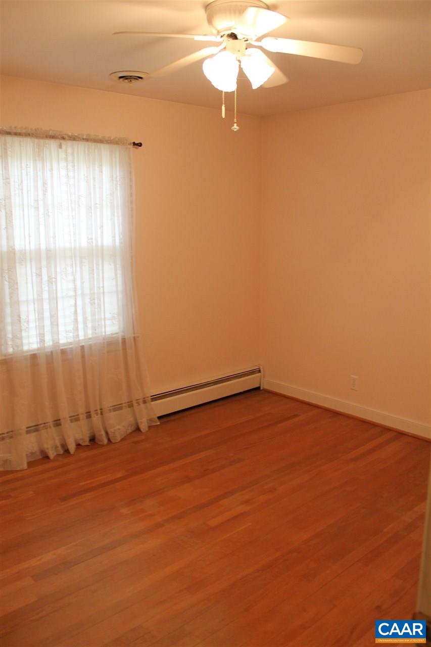 2414 Angus Road Charlottesville, VA 22901 - Photo 16 of 45 an empty room with a window and a ceiling fan