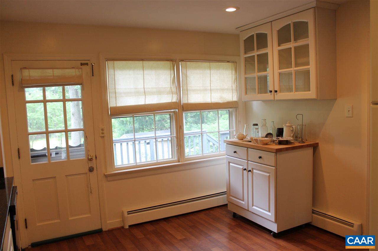 2414 Angus Road Charlottesville, VA 22901 - Photo 18 of 45 a kitchen with stainless steel appliances granite countertop a stove and a window