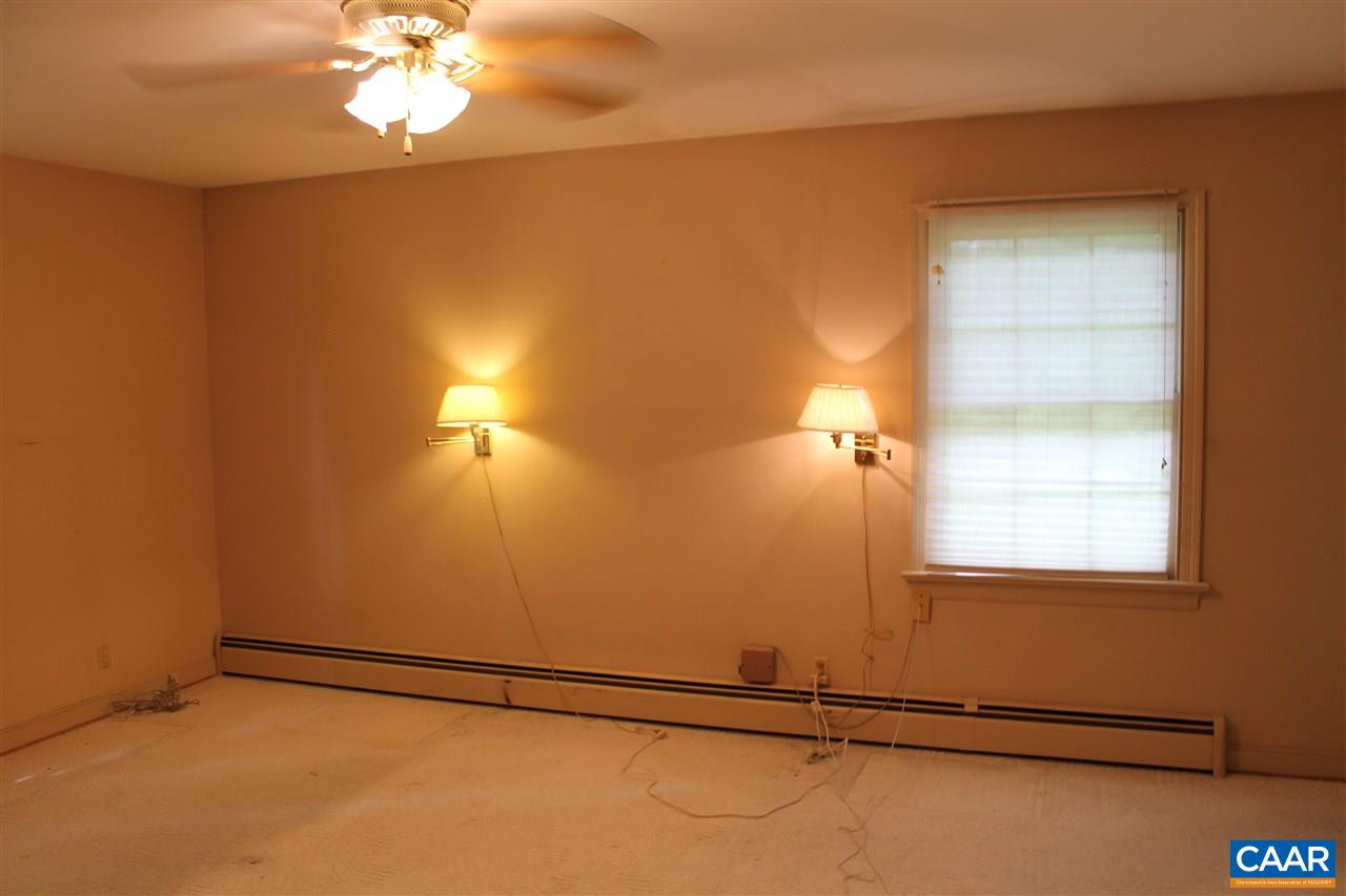2414 Angus Road Charlottesville, VA 22901 - Photo 19 of 45 a view of an empty room with a window