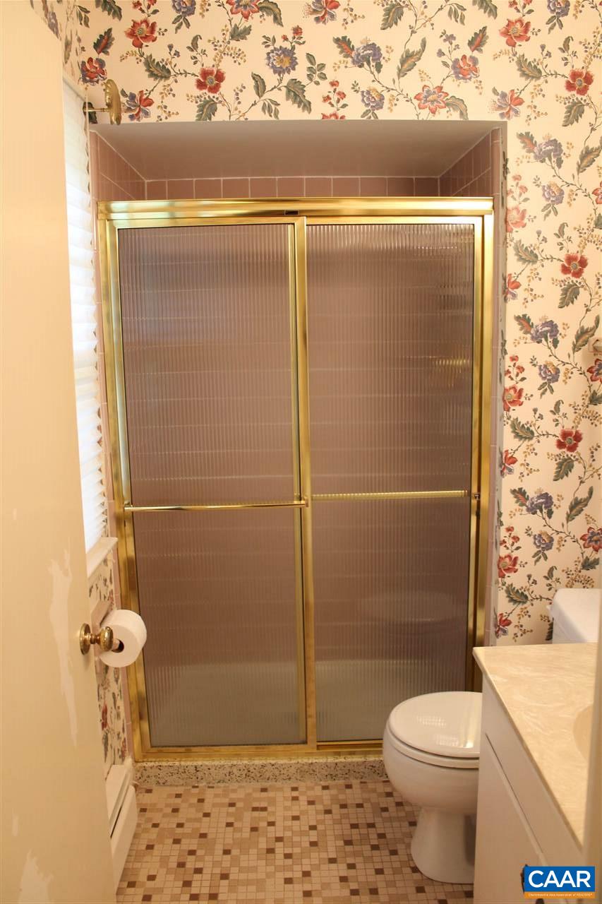 2414 Angus Road Charlottesville, VA 22901 - Photo 22 of 45 a bathroom with a toilet and a shower
