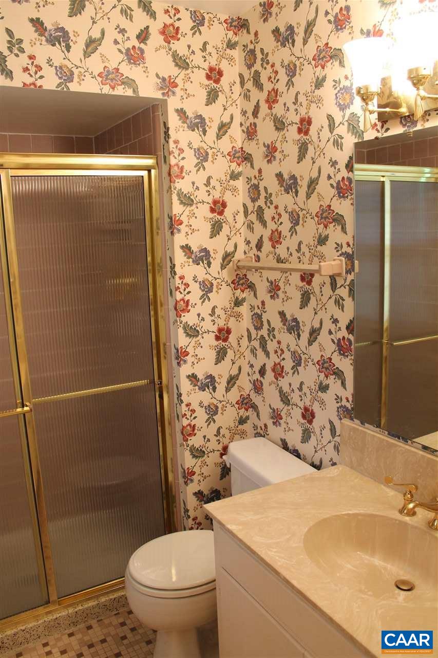 2414 Angus Road Charlottesville, VA 22901 - Photo 23 of 45 a bathroom with a granite countertop sink toilet and shower