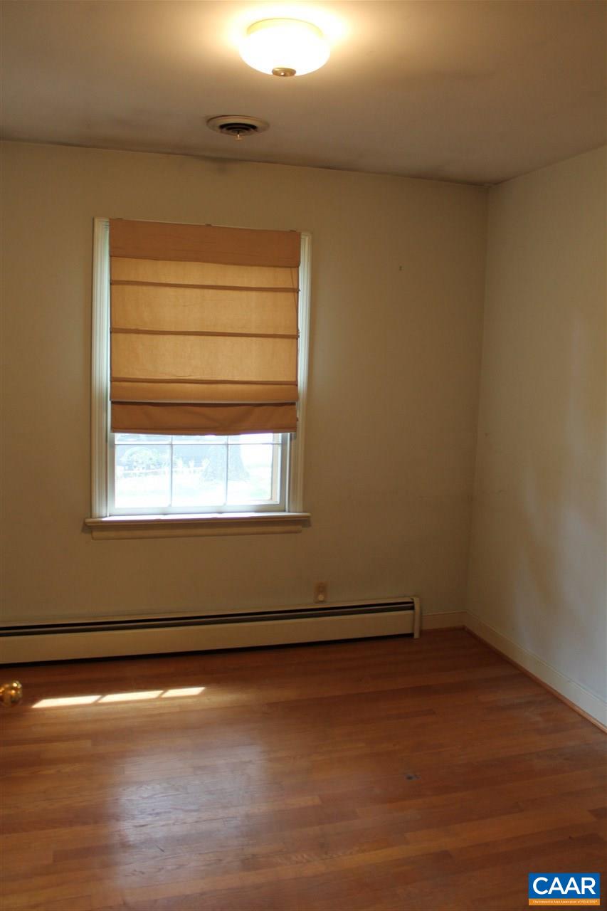 2414 Angus Road Charlottesville, VA 22901 - Photo 26 of 45 a view of a room with wooden floors and a window