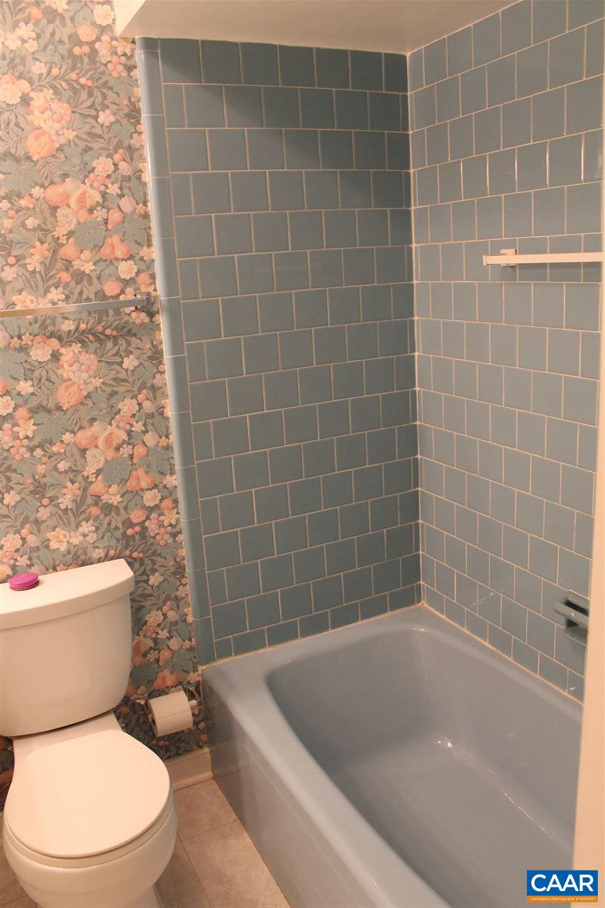 2414 Angus Road Charlottesville, VA 22901 - Photo 27 of 45 a white bath tub sitting next to a toilet