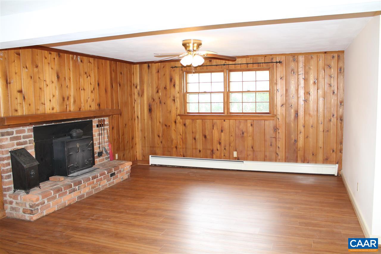 2414 Angus Road Charlottesville, VA 22901 - Photo 28 of 45 a view of wooden floor fire place and windows in a room