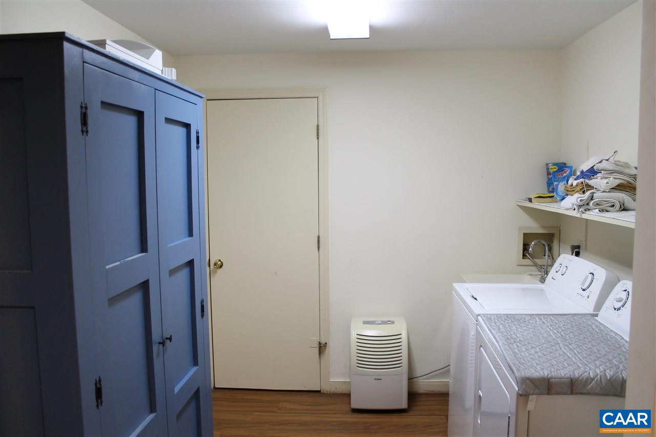 2414 Angus Road Charlottesville, VA 22901 - Photo 42 of 45 a workspace with furniture and wooden floor
