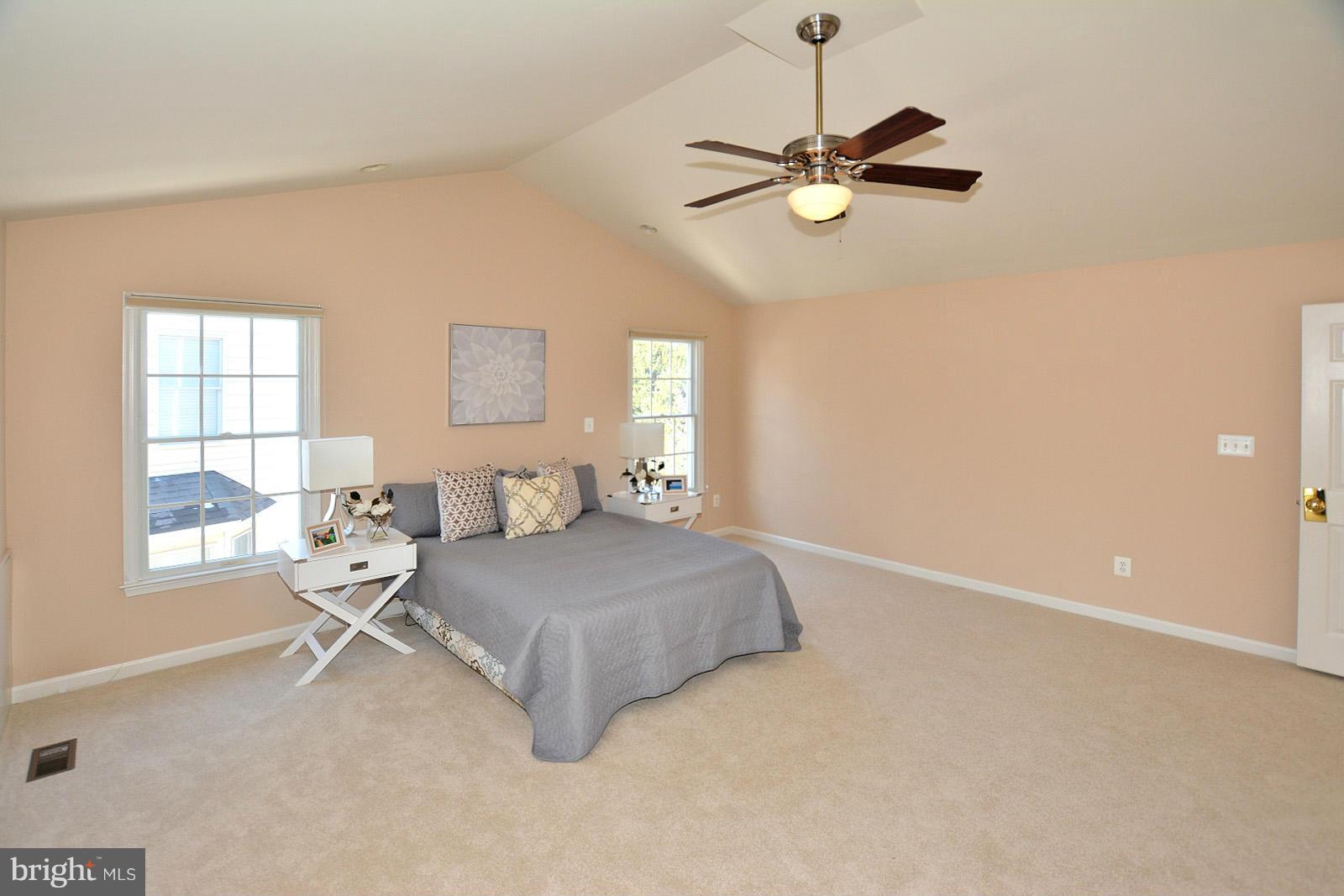 10838 Welbury Court Reston, VA 20194 - Photo 20 of 30 a bedroom with a bed and window