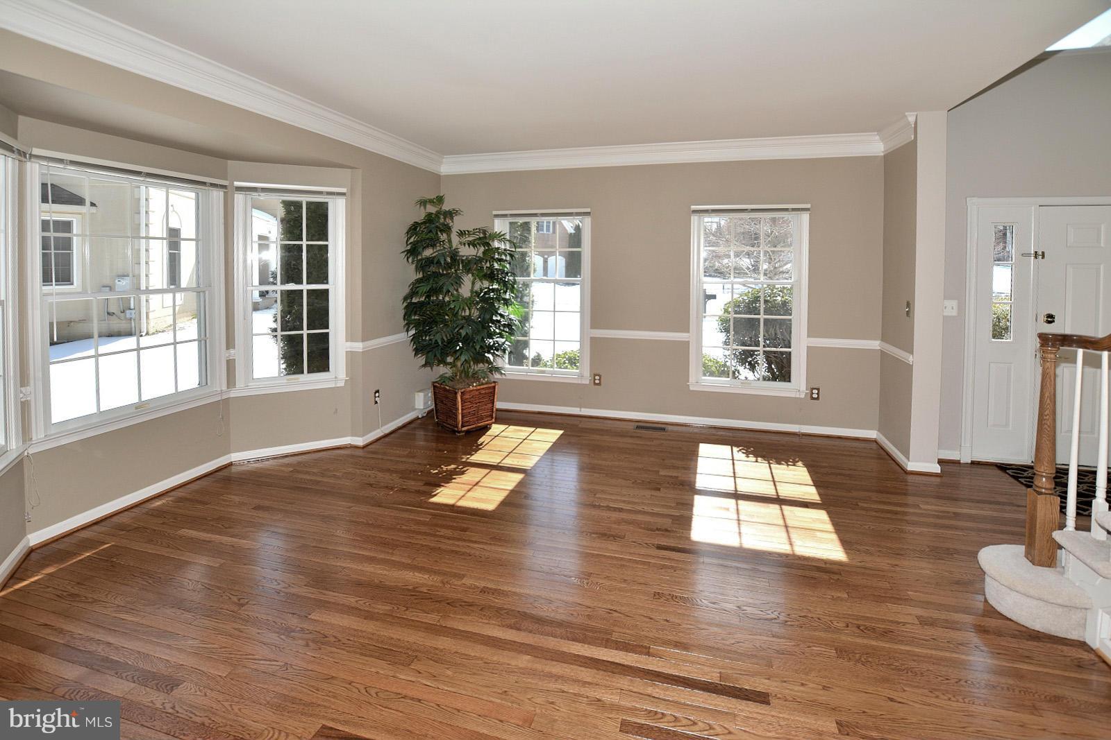10838 Welbury Court Reston, VA 20194 - Photo 3 of 30 a view of empty room with wooden floor and fan