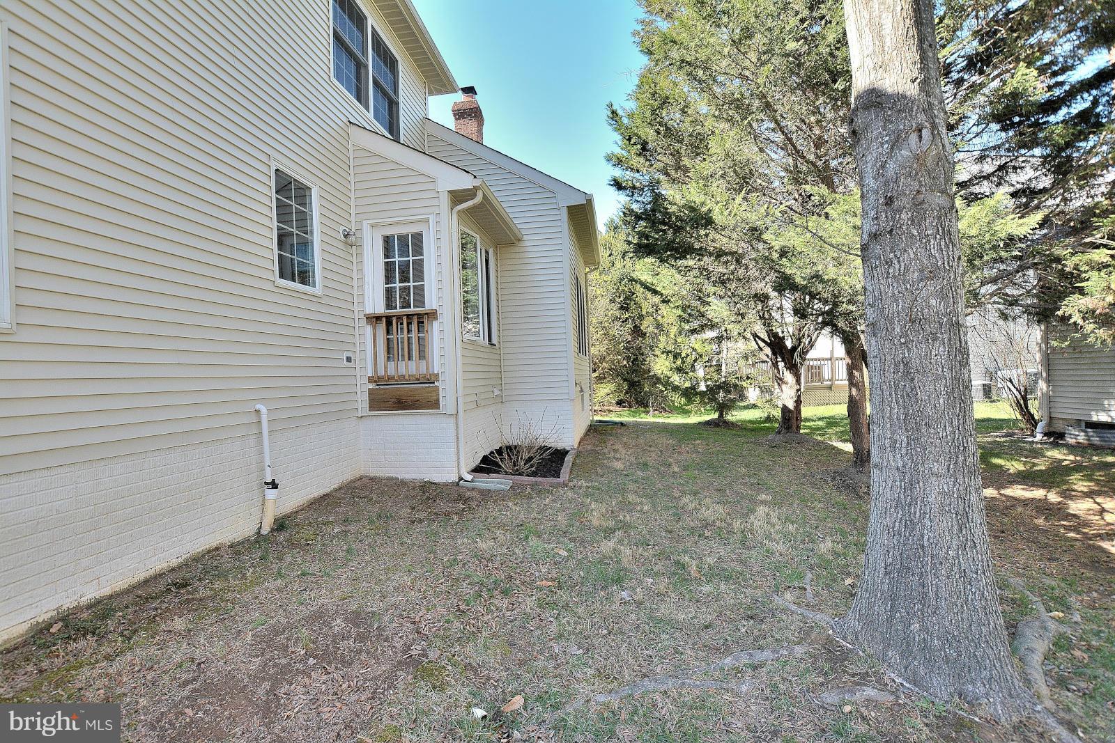 10838 Welbury Court Reston, VA 20194 - Photo 29 of 30 a view of a house with a tree