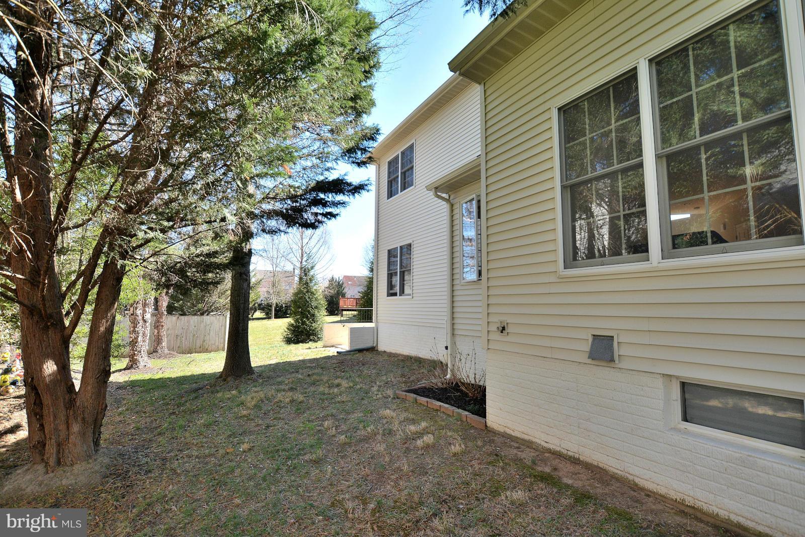 10838 Welbury Court Reston, VA 20194 - Photo 30 of 30 a view of a house with a backyard