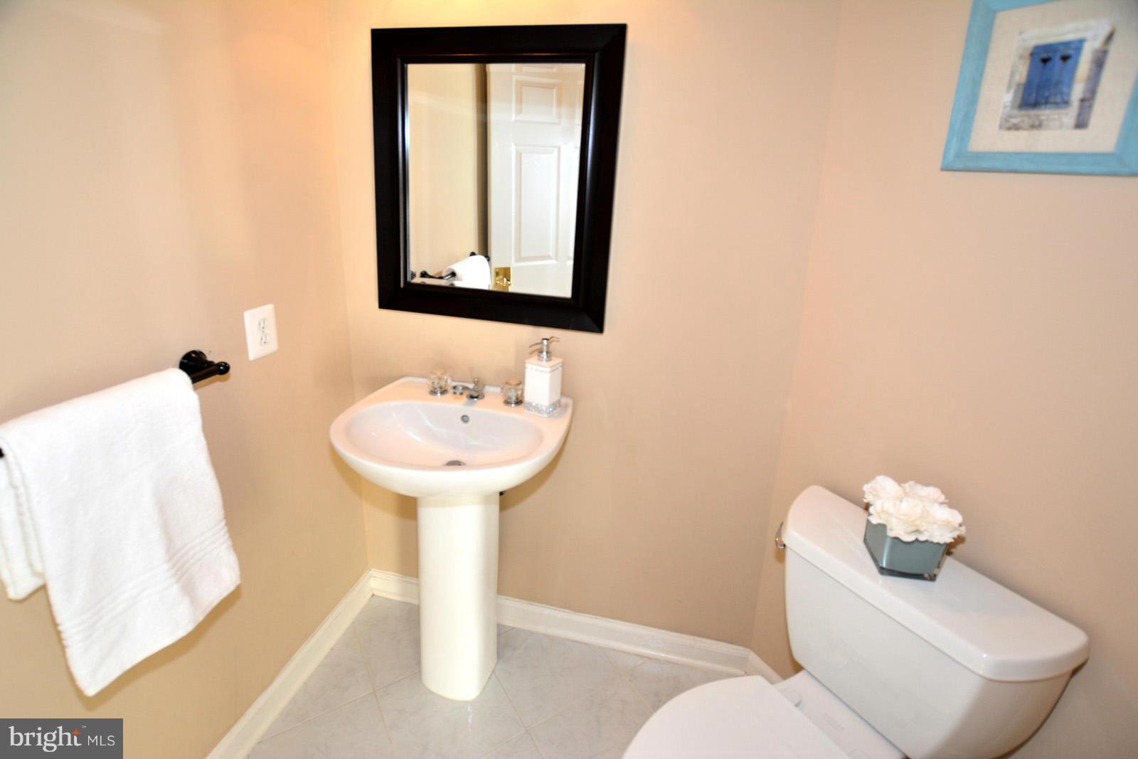 10838 Welbury Court Reston, VA 20194 - Photo 8 of 30 a bathroom with a sink toilet and mirror