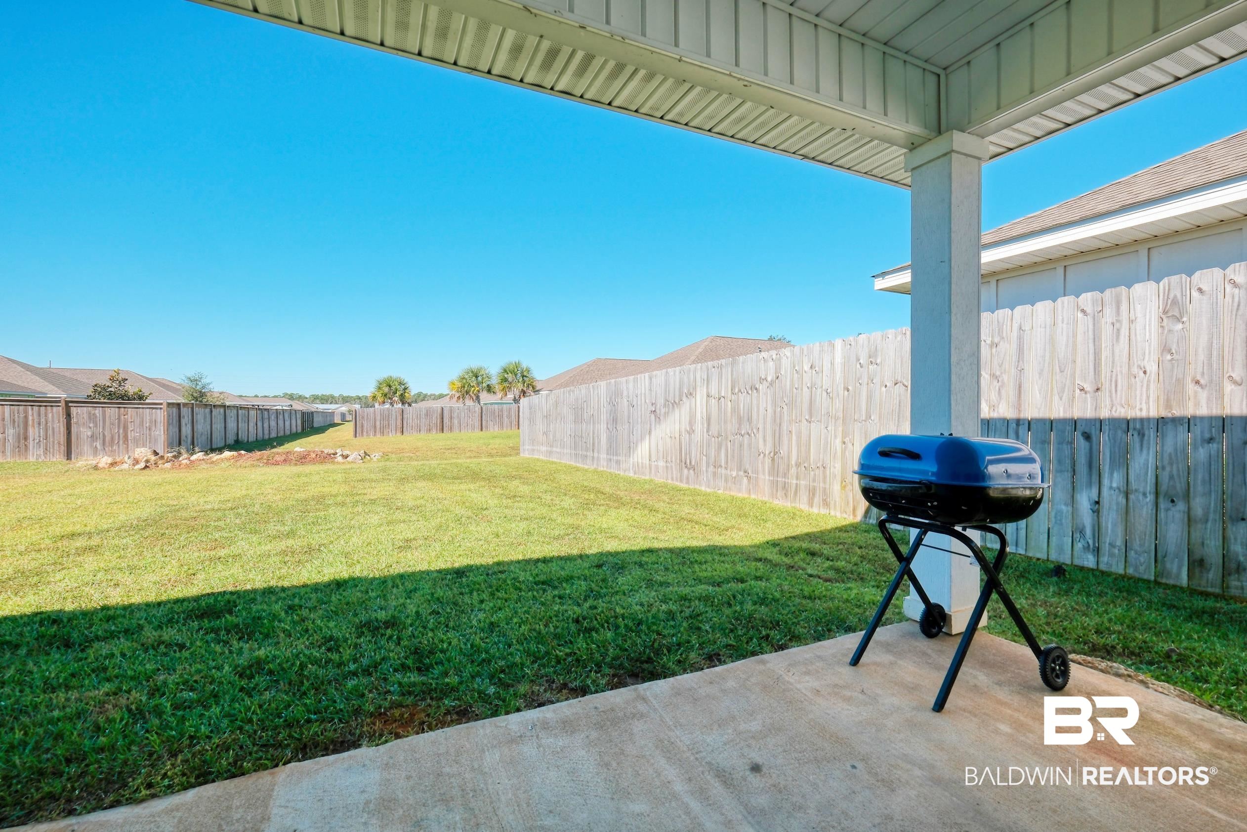 7425 Coppin Drive Foley, AL 36535 - Photo 37 of 41 View of yard featuring a patio area