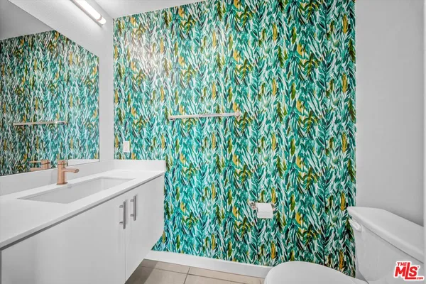 a bathroom with a sink and mirror