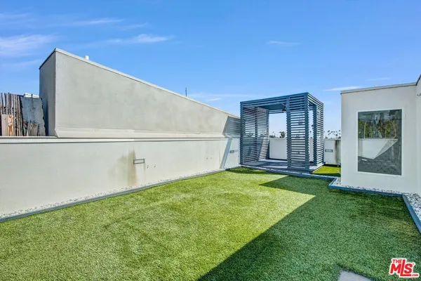 a view of an house with backyard porch and entertaining space