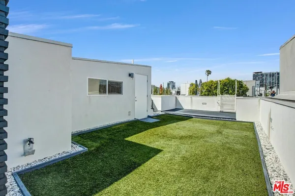 a view of a backyard with a garden and plants